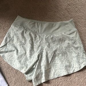 Teal and white patterned athleta shorts